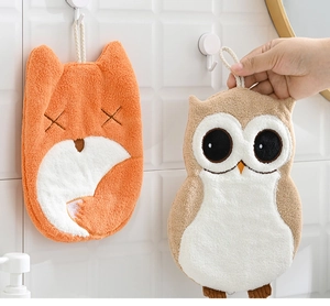 Detail of fox and owl cartoon hand towels with thick coral fleece and hanging loops