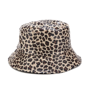 Close-up of leopard print bucket hat featuring a glossy faux leather texture and finish