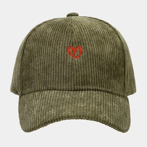 Detail of red heart embroidery on olive green corduroy baseball cap with soft texture