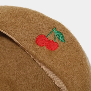 Brown wool beret hat with red cherry embroidery in a minimalist Japanese retro style