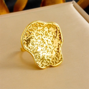 Irregular gold wave ring with unique hammered texture and minimalist geometric design