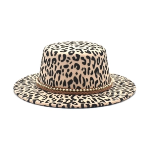 Detail of leopard print felt fedora featuring a gold bead embellished woven hatband