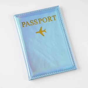 Holographic light blue laser PU leather passport holder with gold airplane icon
