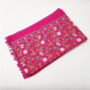 Detailed embroidery view of magenta cashmere-feel scarf with intricate floral patterns