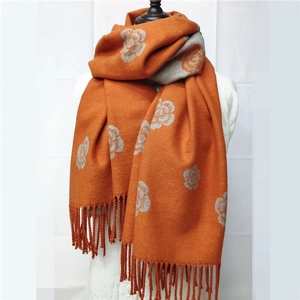 Double-sided camellia jacquard scarf in orange and grey with fringes and soft texture
