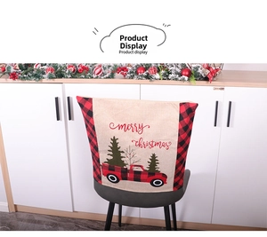 Close-up of linen Christmas chair cover with vintage red truck and buffalo plaid patterns