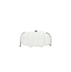 Macro view of white cloud-shaped acrylic evening bag with silver chain and metal clasp