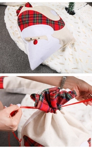Linen Christmas gift bag with Santa Claus embroidery and red ribbon drawstring closure