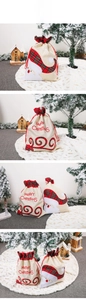 Detailed embroidery of Santa Claus on linen Christmas drawstring gift bag with Merry Christmas text