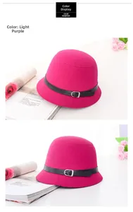 Detail of wool felt bucket hat featuring a black leather band and silver metal buckle