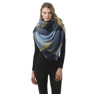 Detail of blue and yellow plaid cashmere scarf featuring elegant fringe hem texture