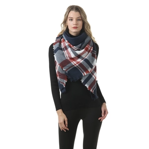 Close-up of winter scarf with red, white and blue plaid pattern and fringe detail