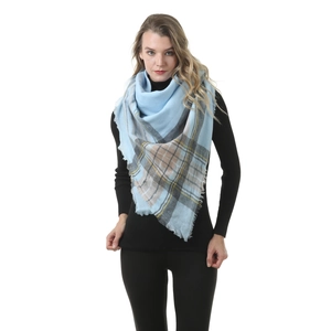 Detailed view of the soft cashmere-like blue checkered scarf with fringe tassels