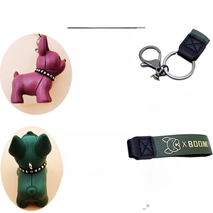 Detail of French bulldog keychains in purple and green with leather straps