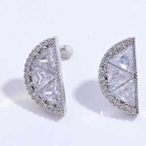 Detail of silver fan-shaped stud earrings with geometric clear cubic zirconia crystals