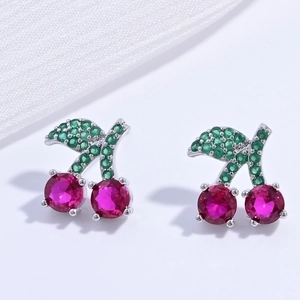 Detail of silver cherry stud earrings with red and green sparkling rhinestones