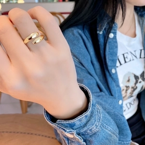 Elegant minimalist 925 sterling silver open ring in gold finish on a model finger