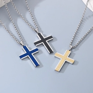 Three men's stainless steel cross necklaces in blue, black and gold colors