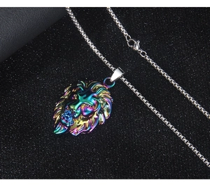 Macro detail of rainbow lion head pendant on silver box chain necklace for men