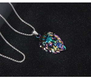 Detailed close-up of a rainbow lion head pendant with a silver necklace on black background