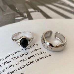 Macro shot of 925 sterling silver vintage rings with black agate stone inlay