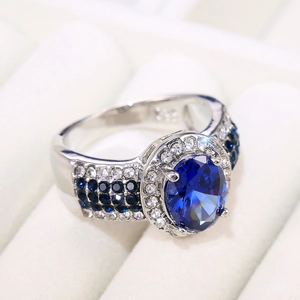 Elegant S925 silver ring with large oval blue sapphire stone and crystal accents