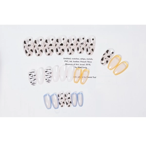 Cow print and minimalist French style coffin press-on nails with colorful accents
