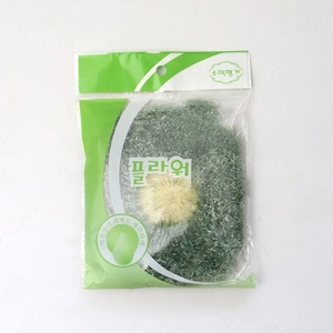 Close-up of flower-shaped dish scrubber in retail packaging with hanging hole design