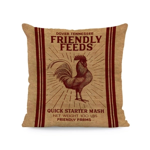 Close-up of vintage beige linen pillow cover featuring a retro rooster feed bag print