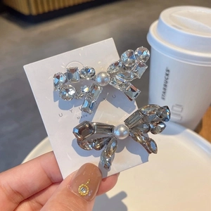 Elegant crystal bow hair clips with pearls in clear and smoky grey on display card