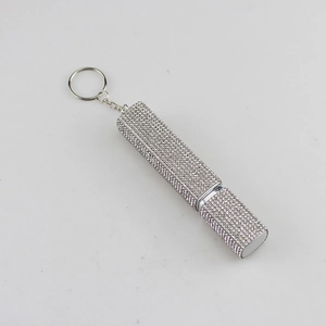 Detailed macro view of a silver rhinestone studded 10ml portable perfume spray bottle