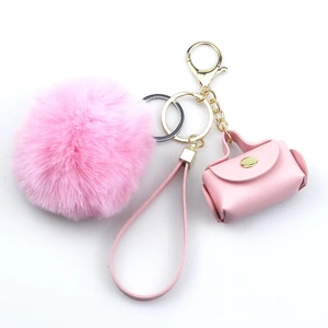 Pink plush faux leather keychain set with mini bag charm and gold metal wrist strap
