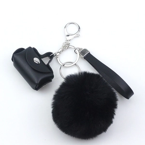 Fashionable faux leather mini bag and black faux fur pompom keychain with wrist strap