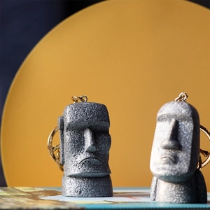 Set of two Moai Easter Island stone statue keychains with realistic grey rock texture