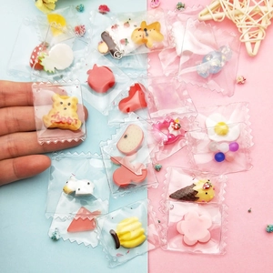 DIY resin charms set including bear, fruit, and food shapes in mini candy bag packaging