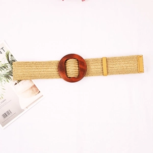 Wide straw woven belt for women featuring a large dark brown circular wooden buckle