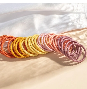 Close-up of colorful elastic twisted fabric hair ties for girls in vibrant assorted colors