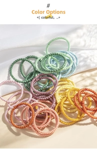 Close-up of colorful spiral elastic hair ties for girls in various bright rainbow colors
