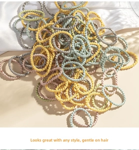 Detail of colorful spiral hair ties with soft fabric texture and elastic design