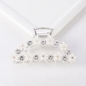 Large silver alloy hair claw clip with frosted white flowers and sparkling rhinestones