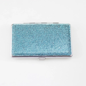 Sky blue rhinestone cigarette case with silver metal frame for women on white background