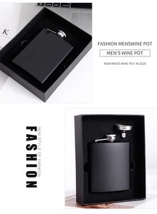Close-up of 8oz matte black stainless steel hip flask with funnel in a gift box