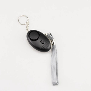 133dB personal safety alarm in black with flashlight, keychain and lanyard on white background