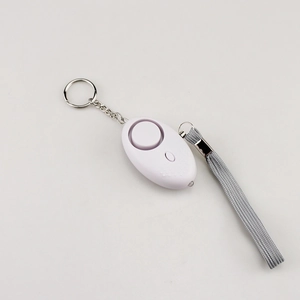 Detail view of the white personal safety alarm with keychain and grey braided lanyard