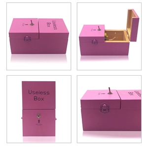 Detail view of pink wooden Useless Box with metal toggle switch and push indicators