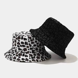 Detail of plush leopard print and black reversible bucket hat for winter style