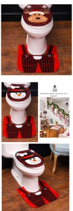 Detailed view of Christmas elk and snowman toilet lid covers with matching U-shaped rugs