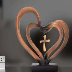 Modern resin heart sculpture with cross pendant and wood grain finish on black base