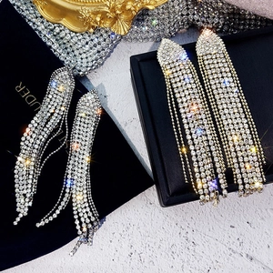 Elegant silver long tassel rhinestone drop earrings on black velvet jewelry box