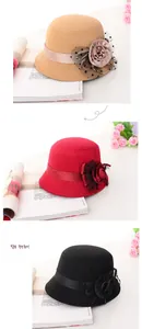 Detail view of winter felt hats with elegant silk flowers and polka dot mesh veils